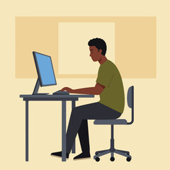 Young man working on computer at desk