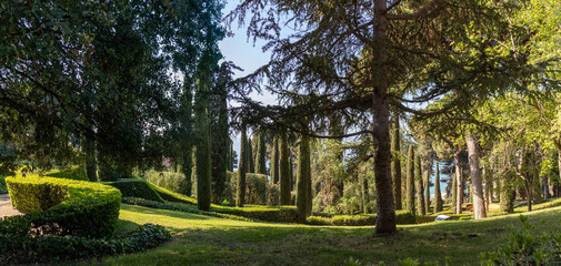 Obraz premium The elegant Santa Clotilde Gardens. This Italian Renaissance-style space combines terraces, classical statues, cypress trees, and gazebos with stunning sea views. Lloret de Mar, Spain