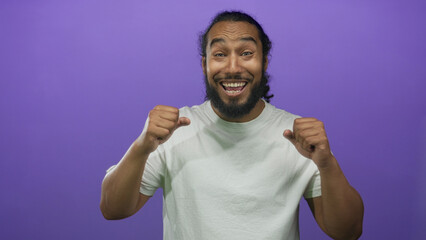 Fototapeta premium Man covering eyes with hands and visible beard wearing white t shirt in studio; surprise celebration excitement.