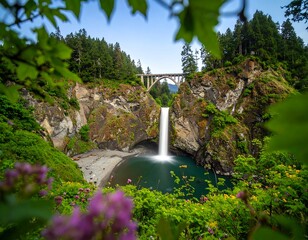 Waterfall cascading into a secluded cove, framed by lush greenery and an arched bridge