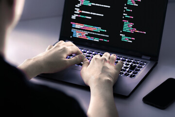 Hacker software in computer. Cybersecurity from malware, ransomware or spyware attack. Develop data on screen. Fraud or breach code in laptop. Cyber threat. Programmer man hacking. Security technology