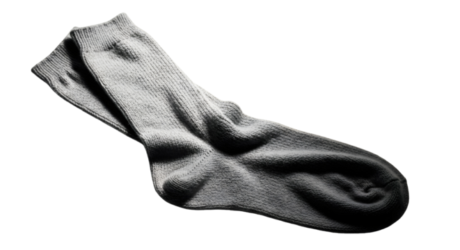 A single, wrinkled, grey sock lies on a white background, casting a subtle shadow.