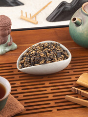 Dried black tea in chahe on the tea table. Tea ceremony.
