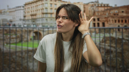 Hispanic woman gesturing outdoors in front of roman ruins, expressing various emotions against a...