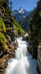 Fototapeta premium Mountain river cascading through a rocky gorge