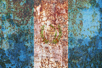 Distressed metal surface exhibits a weathered appearance, with vibrant blue hues contrasting...