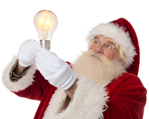 An elderly Caucasian man dressed as Santa Claus holds a glowing light bulb. He has a white beard, glasses, and wears a red suit with white fur trim.