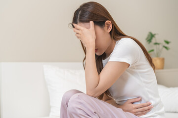 Flatulence ulcer, asian young woman, girl hands in belly, stomach pain from food poisoning,...