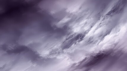 Obraz premium Deep blurred purple background, Dynamic abstract sky with swirling dark purple and white clouds, a powerful, moody atmosphere or storm. Features strong contrast and fluid movement