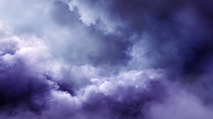 Obraz premium A dramatic, abstract rendering of dense storm clouds, rich in deep purple, indigo, and moody grey tones, swirling with ethereal depth, blurred purple background