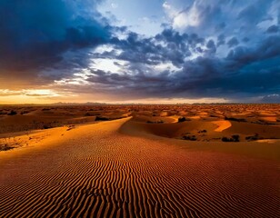 Golden Desert Dunes Under Stormy Skies – Aerial Landscape at Sunset
