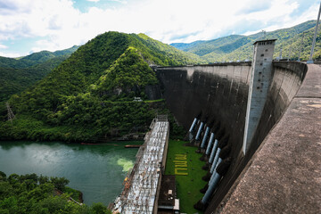 Landscape of Bhumibol Dam, Thailand, beautiful scenery amidst the nature of river near large dam. Renewable hydropower plants for electricity. © elsa 