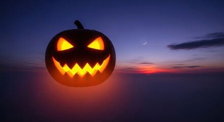 Fototapeta premium Glowing halloween pumpkin with spooky face against a twilight sky background