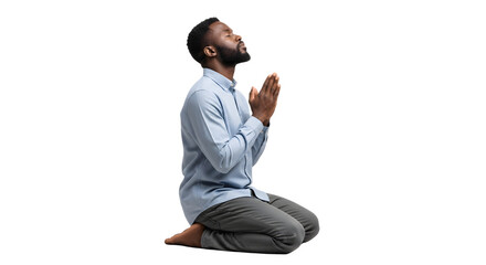 Devout young man with a beard kneeling in prayer.