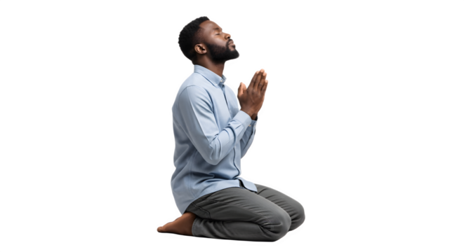 Devout young man with a beard kneeling in prayer.