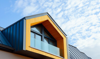 Modern countryside architecture. Image of top of house in countryside.