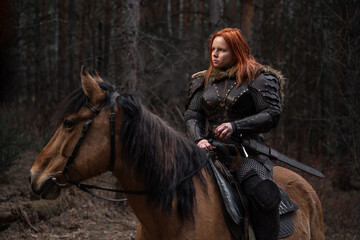 Red-haired warrior rides majestic horse through dark forest, evoking fantasy and strength.