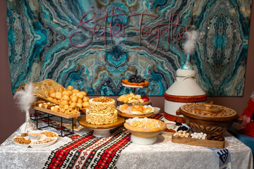 Festive table with Kazakh traditional dishes and treats