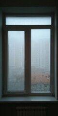 Fototapeta premium Misty Window Pane: Fogged Glass in Cozy Room Setting