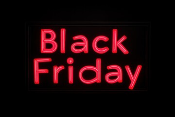 Neon Black Friday Display: A vibrant, illuminated neon sign spells out Black Friday, casting a radiant glow against the dark background.