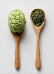 Two wooden spoons, one holding a scoop of vibrant green ice cream, the other a pile of dried green tea leaves, set against a plain white background