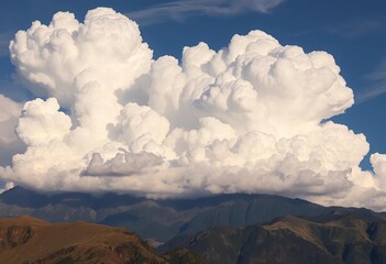 Dense cumulonimbus clouds building over a mountain range, storm clouds,  awe-inspiring