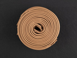 Aroma incense spirals on the black background