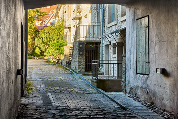 Old stone courtyard passage in the historic center of Tallinn, Estonia