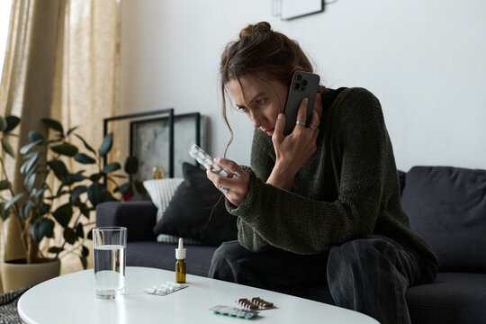 Young woman struggles with her feelings while alone at home, reflecting on difficult moments