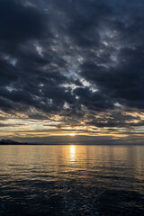 sunset over Lake Constance / Bodensee in Bregenz Vorarlberg Austria with clouds and intense colours and blue sky