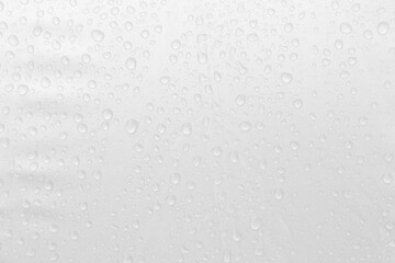 Rain drop on grey plastic background, abstract water drop on grey background