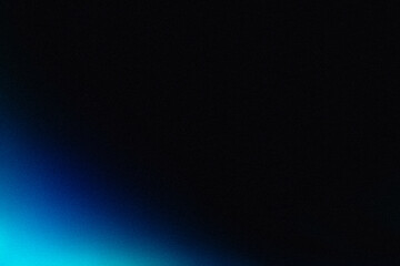 Blurred grainy dark background with blue light in the lower left corner, futuristic gradient texture