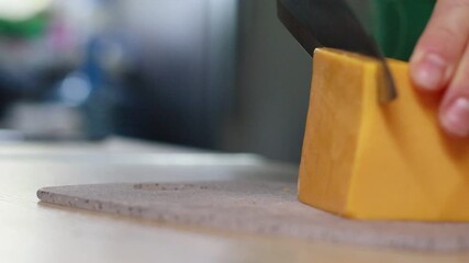 Close-up footage of hands slicing cheddar cheese, placing it on a slice of bread, and adding fresh cherry tomatoes on a plate. Perfect for food blogs, cooking tutorials, recipe videos - Powered by Adobe