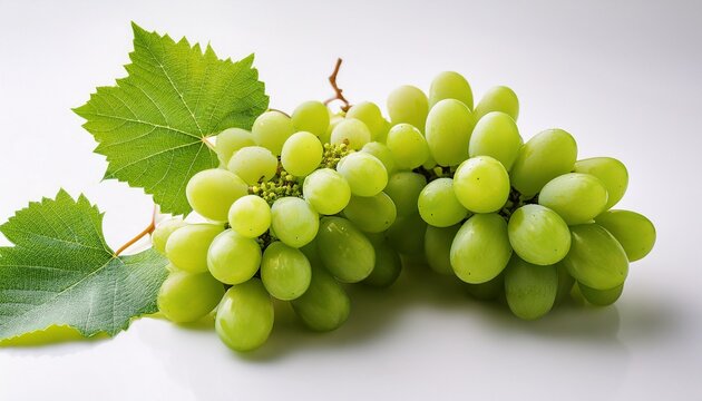 clusters of fresh green grapes with vine leaves on a pristine white surface
