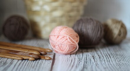 Clews balls of yarn wool and crochet hooks and a basket photo 
