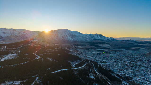 Sunrise over the snowy mountains and city of Esquel in Chubut province, Patagonia Argentina.