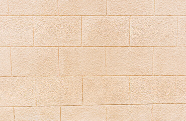 Abstract background of a beige brick wall. A sample of brick laying. Beautiful brick texture. model of building material. A copy of the space