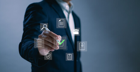 Businessman using digital pen to approve virtual checklist icons, representing task completion, document validation, secure workflow system and digital transformation in business