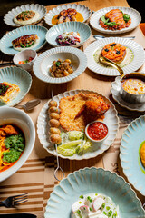 Tables filled with colorful plates of delicious foods, inviting friends and family to share