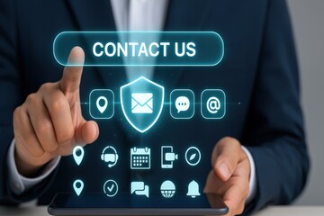 Person in a dark suit is using a digital touch screen interface, and the screen features icons of communication and contact methods, including a button that says ?Contact Us?, with the fingertip...