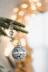 Christmas Tree Decor with baubles, Close Up. Stylish decorated Christmas tree for winter quotes. Green, blue and silver palette