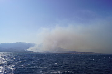 Forest Fires and smoke by the Rio - Antirio Bridge Charilaos Trikoupis in the Greek Mediterranean Sea