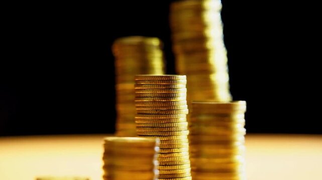 Stop motion of a pile of gold coins, reduced investment and reduced profits on a white isolated background. abstract background 4K HD