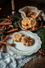 Fototapeta premium Delicious Star-Shaped Christmas Cookies on an Antique Plate with Festive Decorations