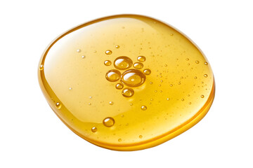Golden honey droplet with bubbles isolated on white background