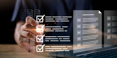 Digital evaluation and performance review concept with checklist and data analysis on a virtual screen. Businessman using technology for assessment, quality assurance, efficient task organization