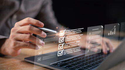 Business evaluation and digital checklist concept with a professional using a laptop to review performance metrics, complete assessments, and ensure quality standards through data analysis.
