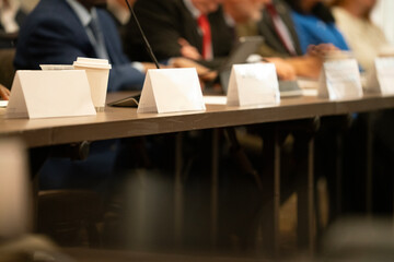 Many people at a high pressure business meeting