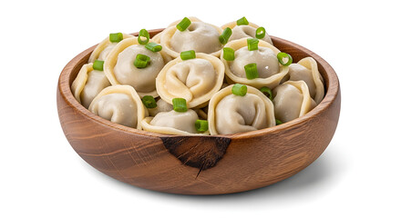 Steamed pelmeni dumplings served in wooden bowl and topped with chopped green onions, isolated on white background.
