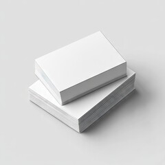 Stacked blank white business cards on bright surface